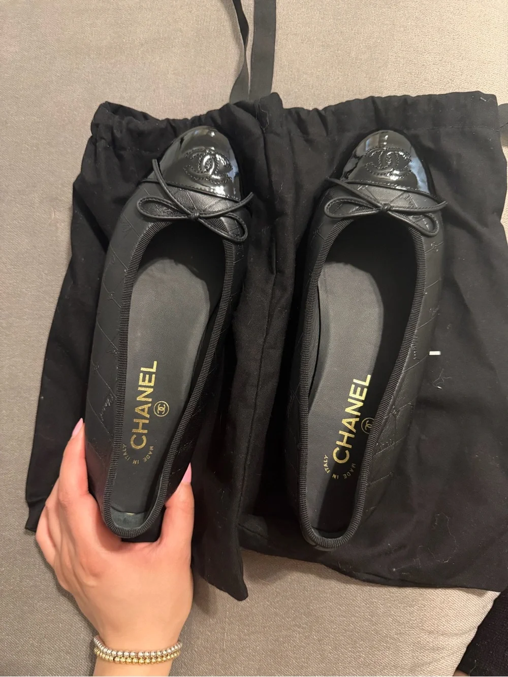 CHANEL Black Quilted Leather Cap-Toe Bow Ballet Flats
